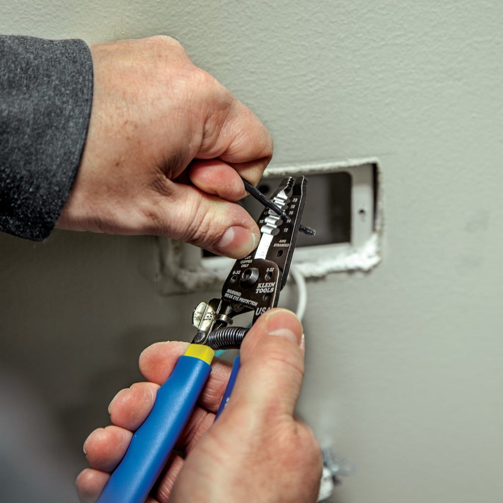Image of WIRE STRIPPER/CUTTER W108316 in use.
