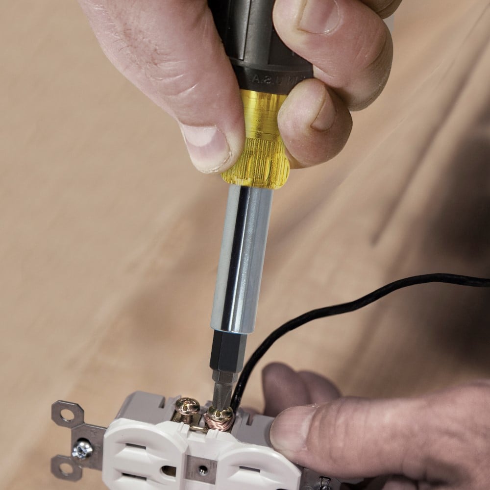 Image of HEAVY-DUTY MULTI-BIT SCREWDRIVER/ NUT DRIVER in use.
