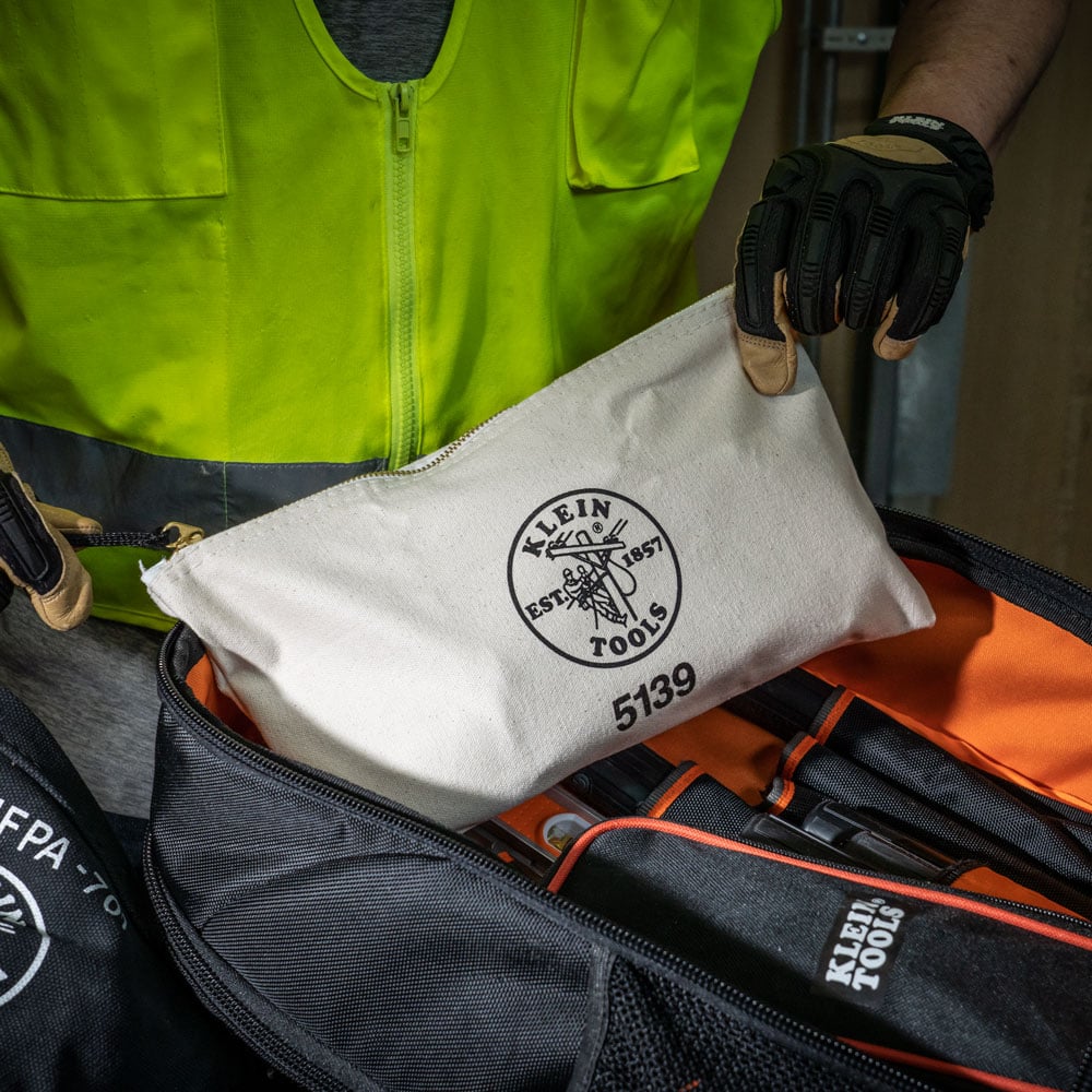 Image of 7X12 CANVAS ZIPPER BAG in use.