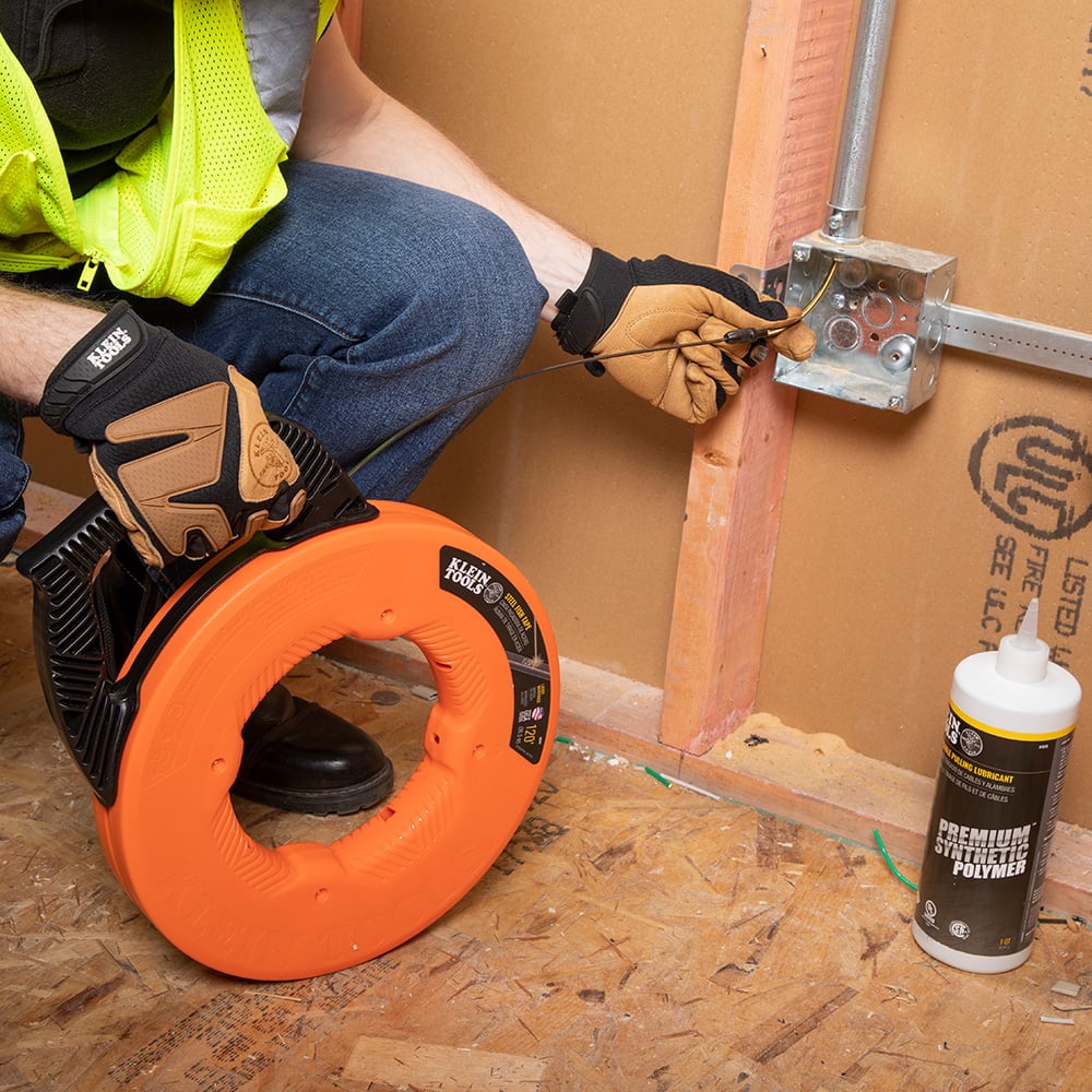 Alternate image of STEEL FISH TAPE, 1/8 IN X 120 FOOT in use.