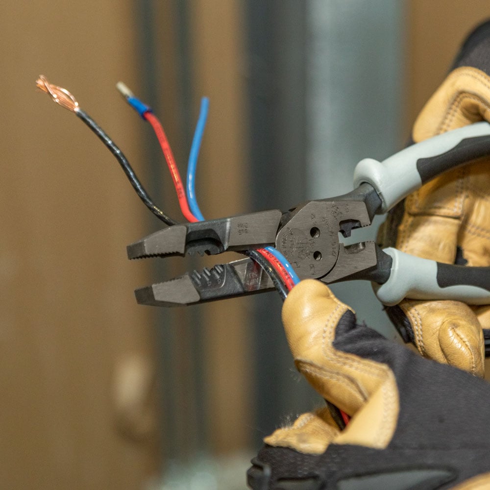 Alternate image of HYBRID PLIERS WITH CRIMP ER, FISH TAPE PULLER AND in use.