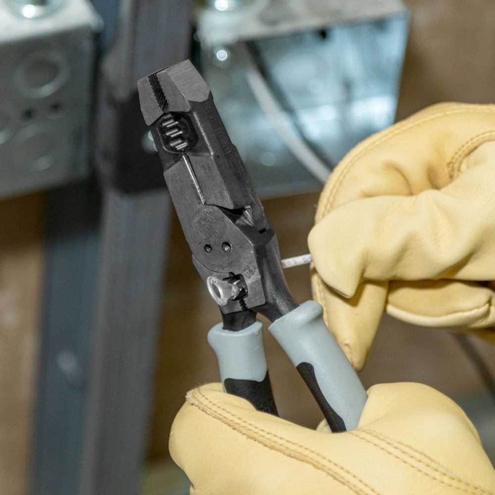 Image of HYBRID PLIERS WITH CRIMP ER, FISH TAPE PULLER AND in use.