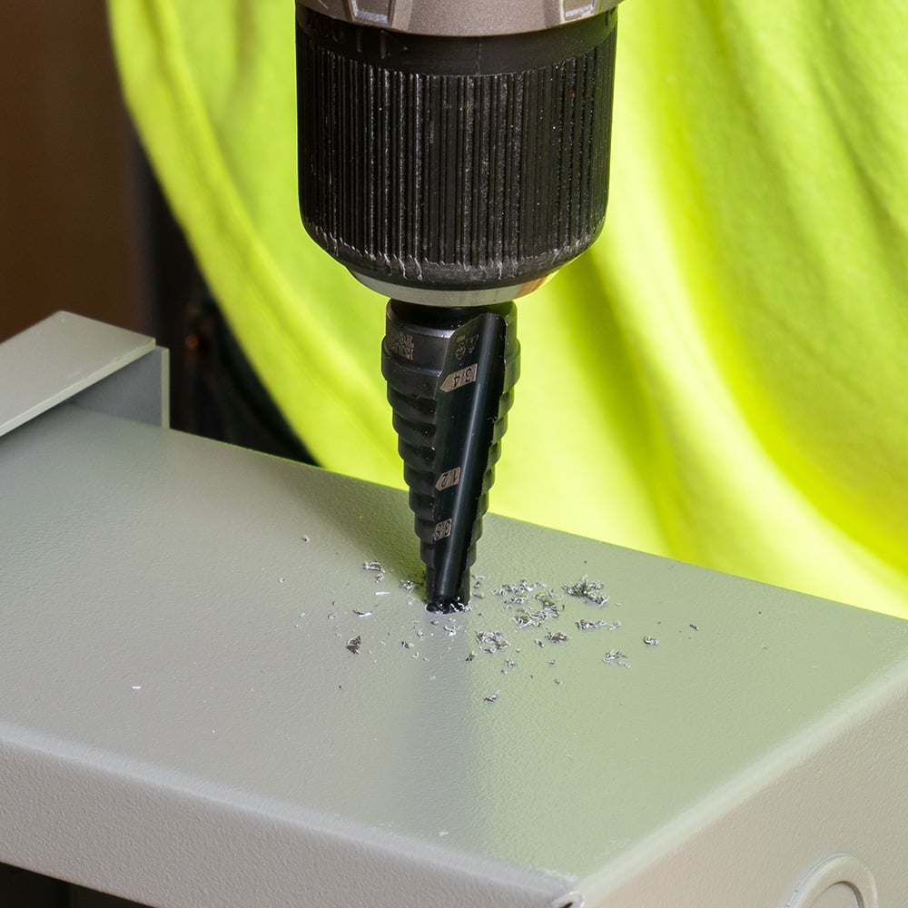 Alternate image of STEP DRILL BIT #3 - DOUB LE-FLUTED in use.