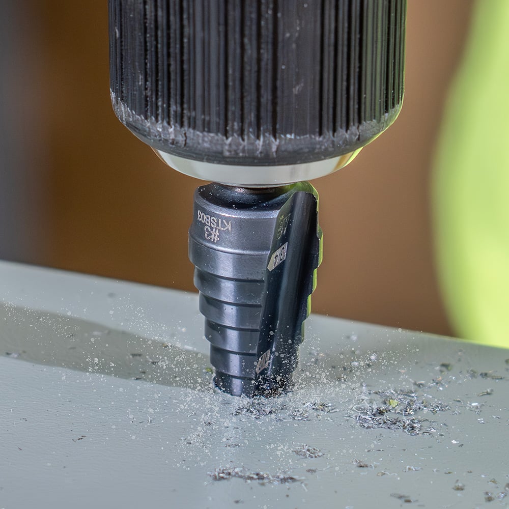 Image of STEP DRILL BIT #3 - DOUB LE-FLUTED in use.